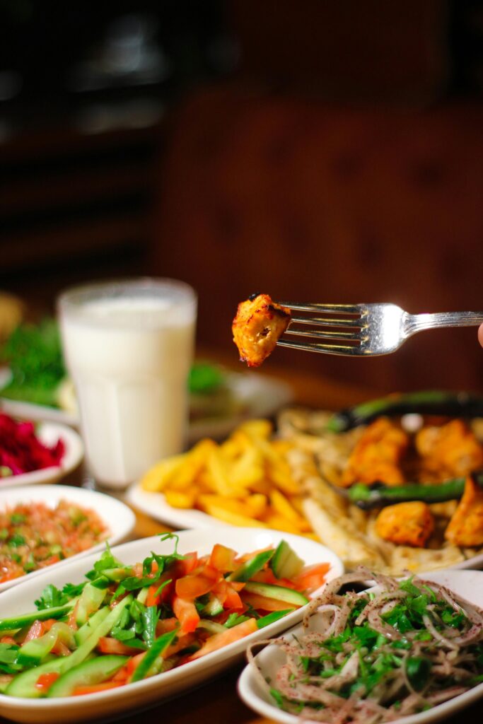 Mouth-watering Mediterranean spread with fresh salads, grilled veggies, and seasoned fries.